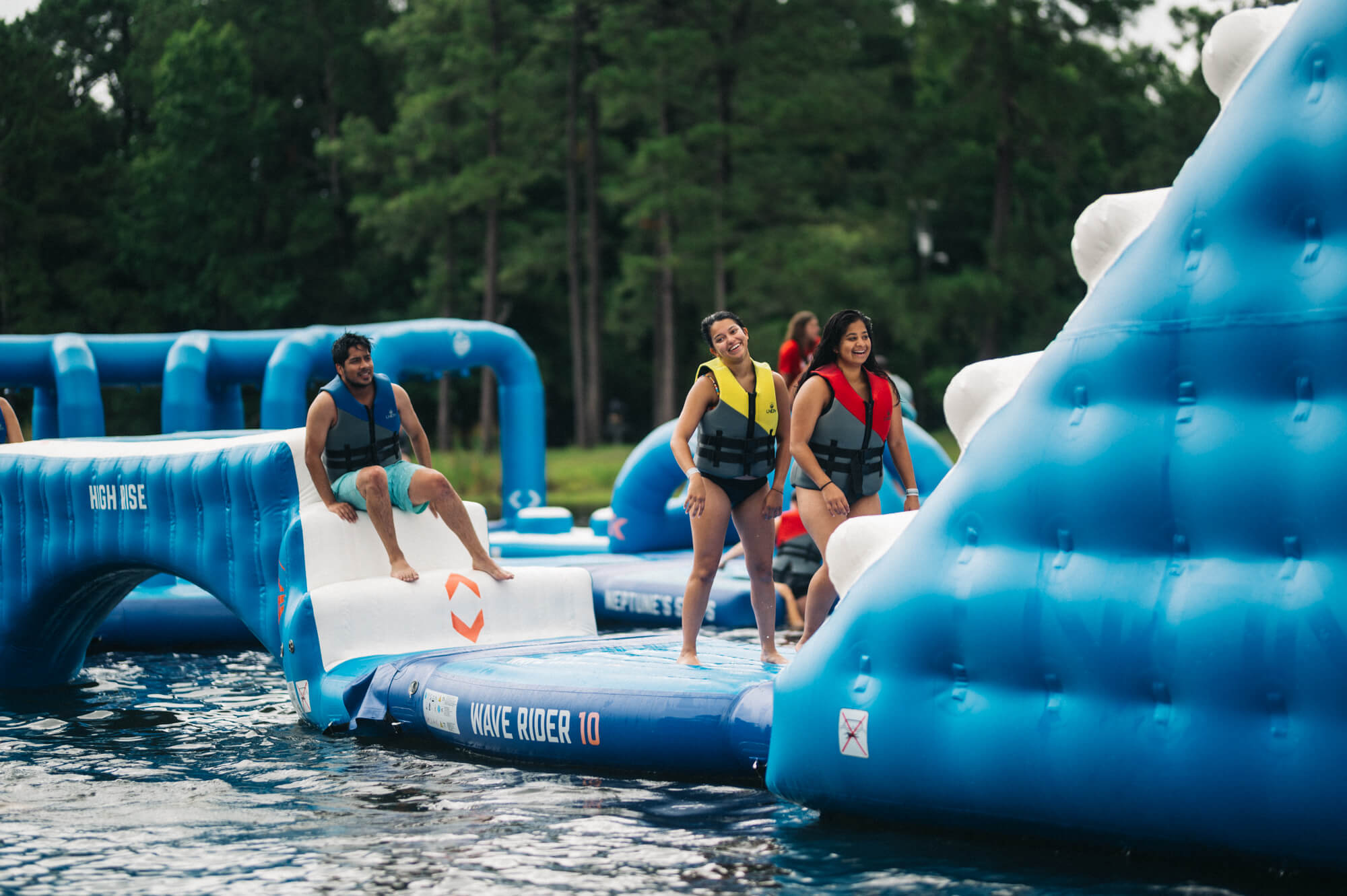 Adults having fun on the aqua park