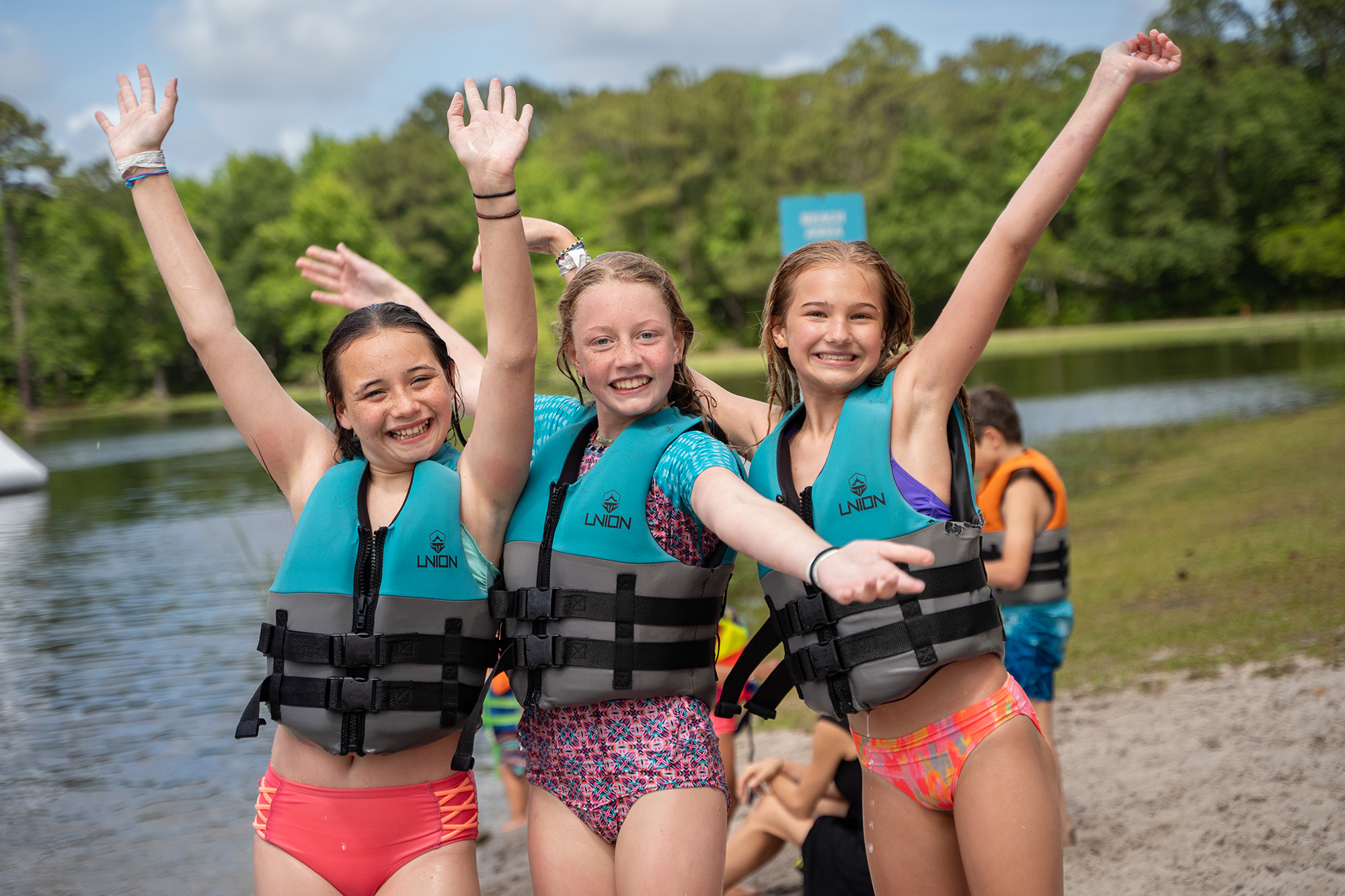 Kids standing on their paddle boards